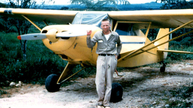 Nate Saint standing beside his Piper PA-14 bush plane in Ecuador, mid-1950s